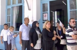 Women lining up to vote in September's presidential election. (L. Bryant/VOA)