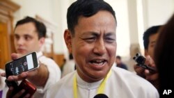 FILE - Myanmar Information Minister Ye Htut talks to journalists during a press briefing at the parliament building, Aug 18, 2015, in Naypyitaw, Myanmar.