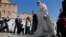 Pope Francis arrives to lead his Wednesday general audience in Saint Peter's square at the Vatican, Sept. 25, 2013.