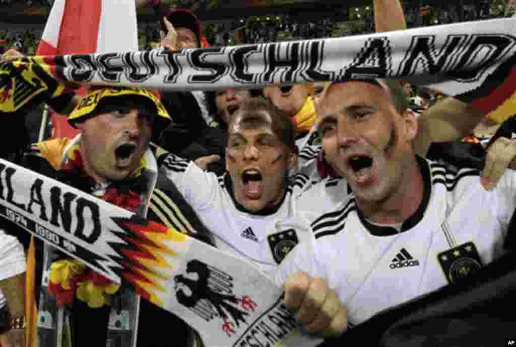 German fans celebrate after the World Cup group D soccer match between Germany and Australia at the stadium in Durban, South Africa, Sunday, June 13, 2010. Germany won 4-0. (AP Photo/Gero Breloer)