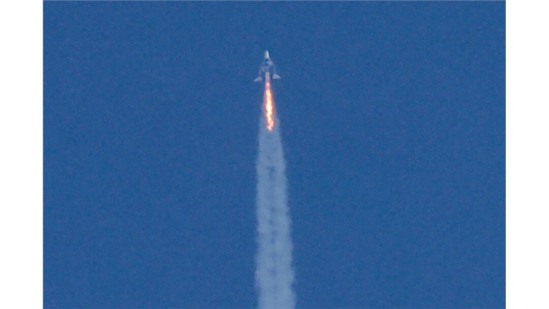 Virgin Galactic's passenger rocket plane VSS Unity, carrying billionaire entrepreneur Richard Branson and his crew, begins its ascent to the edge of space above Spaceport America, near Truth or Consequences, New Mexico, July 11, 2021.