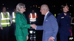 Britain's King Charles meets Sam Mostyn, governor-general of Australia, on his arrival in Sydney for the start of a five-day tour to Australia, Oct. 18, 2024.