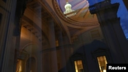 Office lights are seen at the U.S. Capitol as lawmakers work into the evening while the U.S. Senate faces a decision over approving $2,000 stimulus checks on Capitol Hill in Washington, Dec. 30, 2020. 
