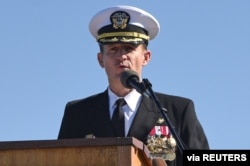 FILE - Captain Brett Crozier addresses the crew as commanding officer of the aircraft carrier USS Theodore Roosevelt in San Diego, California, March 1, 2020.