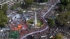 Aerial view of hundreds of people holding a large banner with portraits of people who disappeared during the military dictatorship (1976-1983) upon arrival at Plaza de Mayo Square to commemorate the 48th anniversary of the coup in Buenos Aires on March 24, 2023.