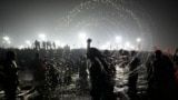 Naga Sadhus or Naked Hindu holy men take dips at Sangam, the confluence of three sacred rivers the Yamuna, the Ganges and the mythical Saraswati, on Vasant Panchami during the Kumbh Mela in Prayagraj, Uttar Pradesh state, India, Feb. 3, 2025.