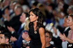 FILE - South Dakota Gov. Kristi Noem stands on the White House lawn during the Republican National Convention in Washington, Aug. 27, 2020. On Sept. 11, North and South Dakota had led the country in new COVID cases per capita over the past two weeks.