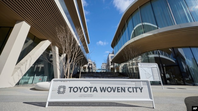 This photo provided by Woven by Toyota shows the sign of Toyota Woven City in Susono city, Shizuoka Prefecture on Feb. 2025. (Woven by Toyota via AP)