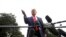 President Donald Trump speaks to members of the media on the South Lawn of the White House in Washington, Oct. 3, 2019.