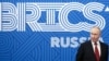 (FILES) In this pool photograph distributed by the Russian state agency Sputnik, Russia's President Vladimir Putin looks on during a meeting with Iran's conservative Parliament Speaker on the sidelines of a BRICS (the bloc that includes Brazil, Russia, In