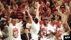 Michael Jordan and the Chicago Bulls celebrate on June 13, 1997 in game six of the NBA Finals. Shoes worn by Michael Jordan in that famous "Flu Game" were sold at auction for $1.38 million, Goldin memorabilia marketplace announced June 15, 2023.