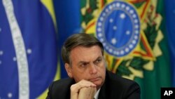 Brazil's President Jair Bolsonaro holds a press conference in Brasilia, Brazil, Aug. 1, 2019. 