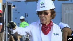 FILE - Former U.S. First Lady Rosalynn Carter helps build a home in Memphis, Tennessee., for Habitat for Humanity on August 22, 2016.