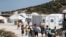 Refugees and migrants from the destroyed Moria camp enter a new temporary camp on the island of Lesbos, Greece, Sept. 20, 2020. 