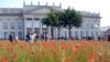 FILE - Visitors of the 'documenta 12' are seen through the 'Poppy Field' installation of Croatian artist Sanja Ivekovic in Kassel, Germany, Aug. 4, 2007. 