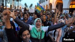 Protesters take part in a rally in Rabat, Morocco, after a fishmonger was crushed to death inside a garbage truck as he tried to retrieve fish confiscated by police, Oct. 30, 2016.