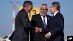 U.S. Secretary of State Antony Blinken, right, is welcomed by U.S. Ambassador to Israel Jack Lew, left, and Israeli Ministry of Foreign Affairs Deputy Director General for North America Lior Hayat in Tel Aviv, Israel, Oct. 22, 2024.