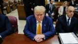 TOPSHOT - Former US President Donald Trump attends his trial for allegedly covering up hush money payments linked to extramarital affairs, at Manhattan Criminal Court in New York City, on May 2, 2024.