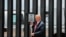 FILE - U.S. President Donald Trump prepares to autograph a plaque commemorating the construction of the 200th mile of border wall while visiting the wall on the U.S.-Mexico border in San Luis, Arizona, June 23, 2020.