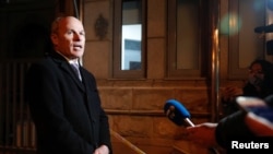 Jim Nickel, charge d'affaires of the Canadian Embassy in Beijing, talks to the media outside Beijing No. 2 Intermediate People's Court after a trial of Michael Kovrig, a Canadian detained in Dec. 2018 on suspicion of espionage, Beijing, March 22, 2021.