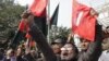 Members of Bangladesh Muktijoddha Sangsad, a welfare association for combatants who fought during the war for independence from Pakistan in 1971, shout slogans after a war crimes tribunal sentenced Abul Kalam Azad to death in Dhaka, January 21, 2013.