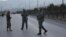 Afghan security forces stand guard near the site of two blasts in Kabul, Afghanistan, Jan. 10, 2017. 