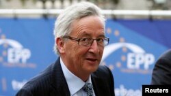 Candidate for the European Commission presidency Jean-Claude Juncker arrives at an European People's Party (EPP) meeting in Brussels, ahead of an informal dinner of EU leaders, May 27, 2014. 