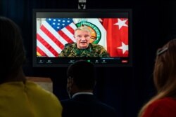 Gen. Frank McKenzie, Commander of U.S. Central Command, appearing on screen from MacDill Air Force Base, in Tampa, Fla.