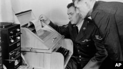 This Aug.30, 1963 black-and-white file photo shows the White House Kremlin "hot line" providing direct communication for emergency use by the Chief of Staff in Washington and Moscow, becaming operational. 
