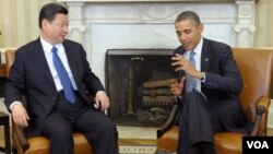 Presiden China Xi Jinping (kiri) dan Presiden AS Barack Obama akan membahas masalah keamanan dunia maya minggu depan (foto: dok). 