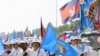 Supporters of the ruling Cambodian People's Party campaign during a commune elections rally in Phnom Penh, Cambodia, Friday, May 18, 2012. The campaign was kicked off Friday for the June 3 commune elections. 