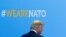 U.S. President Donald Trump walks during the welcoming ceremony at the start of a NATO summit at the Alliance’s headquarters in Brussels, Belgium, July 11, 2018. 