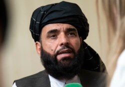 FILE - Suhail Shaheen, spokesman for the Taliban's political office in Doha, speaks to the media in Moscow, Russia, May 28, 2019.