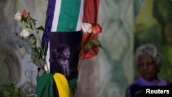 People gather to pay their respects to Winnie Madikizela-Mandela in Durban, South Africa, April 2, 2018. 