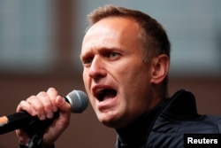 Russian opposition leader Alexei Navalny delivers a speech during a rally to demand the release of jailed protesters, who were detained during opposition demonstrations for fair elections, in Moscow, Sept. 29, 2019.