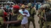 Tanzania's main opposition party CHADEMA's chairman Freeman Mbowe is detained by Tanzanian police during protests to condemn a series of kidnappings and murders within the Magomeni area of Dar es Salaam, Tanzania, Sept. 23, 2024.