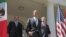U.S. President Barack Obama, (C), Canada's Prime Minister Stephen Harper (R), and Mexico's President Felipe Calderon (L) walk out of the Oval Office before a joint press conference in the Rose Garden of the White House in Washington, April 2, 2012.