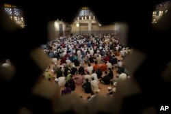 FILE —Muslims marking the end the holy fasting month of Ramadan in Kuala Lumpur, Malaysia, April 10, 2024