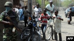 A Nigerian soldier, part of the "Operation Flush" patrolling the remote northeast town of Baga, Borno State, April 30, 2013.