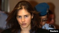 FILE - Amanda Knox, the U.S. student convicted of murdering her British flatmate Meredith Kercher in Italy in Nov. 2007, arrives at the court during her appeal trial session in Perugia, Sept. 30, 2011.