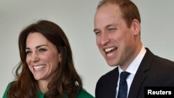 Britain's Prince William and Catherine, Duchess of Cambridge, share a laugh in London, March 10, 2016. They plan to tour the Taj Mahal during a trip to India in April. 