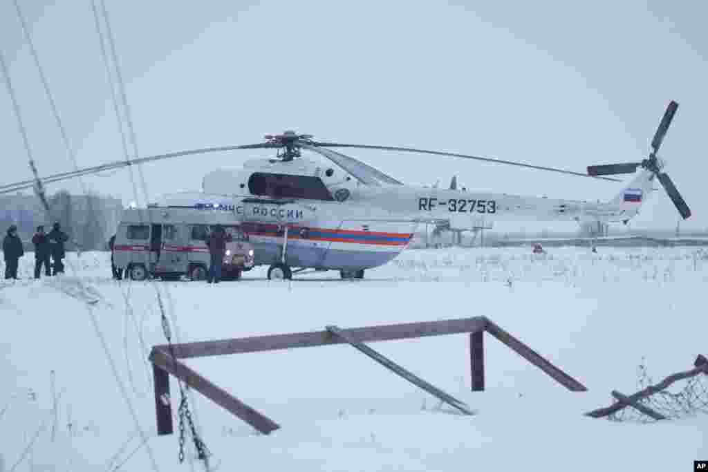 An Emergency Situations Ministry vehicle is parked next to an Emergency Situations Ministry helicopter near the prison where Mikhail Khodorkovsky was kept in Segezha, near Petrozavodsk, Dec. 20, 2013.