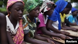 Pupils attend a koranic school in the town of Small Sefoda in eastern Sierra Leone, April 22, 2012. 