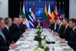 FILE - President Donald Trump speaks during a working lunch with leaders of NATO members countries that have met their financial commitments to the the organization, in Watford, England, Dec. 4, 2019.