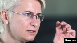 Neringa Venckiene gestures during an interview in Vilnius, Lithuania, Oct. 2, 2012. Venckiene fled to Chicago in 2013, saying she feared for her life after uncovering what she said was a high-level child sex ring.