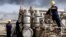 FILE - Iraqi workers at the Rumaila oil refinery, near Basra, 340 miles (550 kilometers) southeast of Baghdad, Iraq, December 2013.
