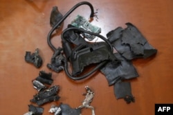 A photograph  taken connected  Sept. 18, 2024, successful  Beirut's confederate  suburbs shows the remains of exploded pagers connected  show  astatine  an undisclosed location.