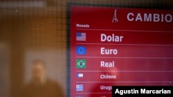 An electronic board is seen at a currency exchange shop, in Buenos Aires, Argentina, Sept. 2, 2019. 