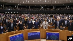 MEP's sing and hold hands after a vote on the UK's withdrawal from the EU, the final legislative step in the Brexit proceedings, during the plenary session at the European Parliament in Brussels, Wednesday, Jan. 29, 2020. The U.K. is due to leave…