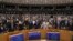 MEP's sing and hold hands after a vote on the UK's withdrawal from the EU, the final legislative step in the Brexit proceedings, during the plenary session at the European Parliament in Brussels, Wednesday, Jan. 29, 2020. The U.K. is due to leave…